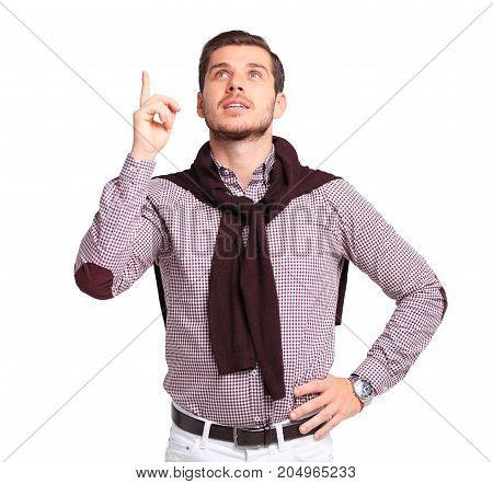Thinking man isolated on white background. Closeup portrait of a casual young pensive businessman looking up at copyspace. Caucasian male model.