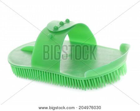 green currycomb in front of white background