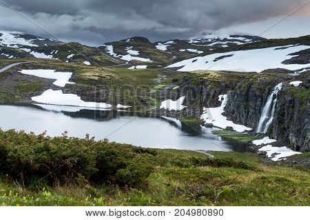 Waterfall in the mountains along the National tourist route Aurlandstjellet. Flotane. Bjorgavegen. Western Norway