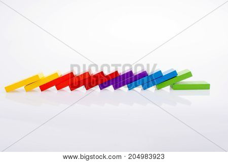 Colorful Domino Blocks in a line on a white background