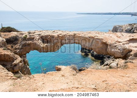 Stone bridge in the park of Cavo Greco close