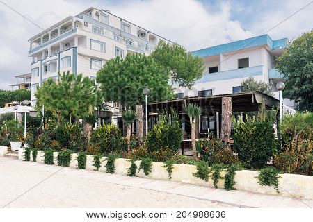 ALBANIA GOLEM- September 20 2015: Guest apartment buildings are surrounded by different plants in the resort area of Golem on the Adriatic coast.