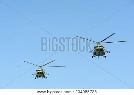 Tyumen, Russia - July 1, 2017: Army Games. Engineering Formula contest. 2 Military helicopter MI-8 in the cloudy sky