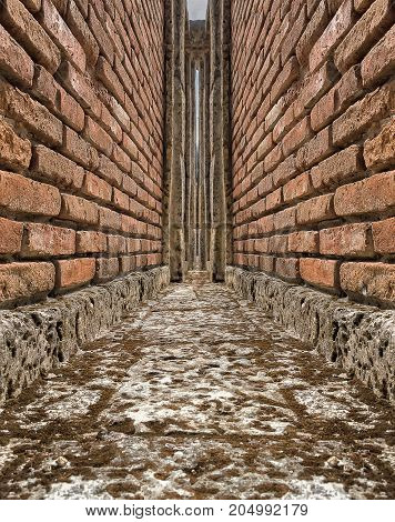 abstraction background converging stone walls on a concrete foundation