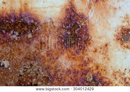 Rusted melal texture. Ferruginous and grungy steel metal wall with heavy corrosion background pattern.
