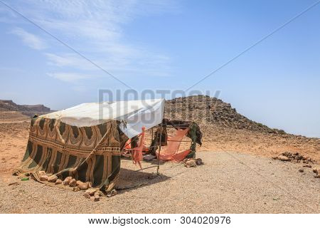 An abandoned camel herders tent at Jebel Samhan plateau, Oman