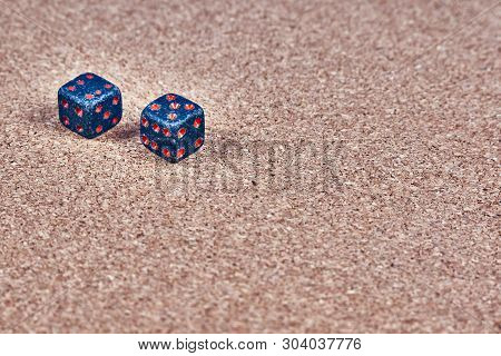 Game Dice From A Natural Stone Lie On A Pith Background. Close-up