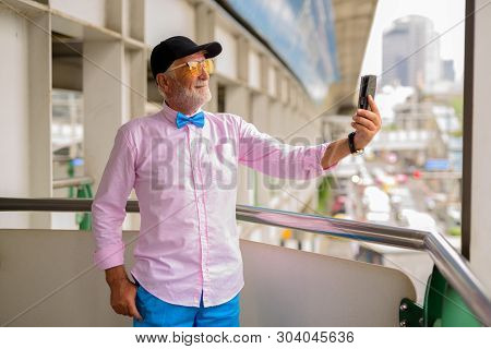 Handsome Senior Tourist Man Exploring The City Of Bangkok, Thail