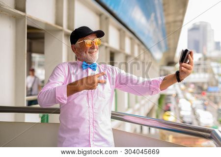 Handsome Senior Tourist Man Exploring The City Of Bangkok, Thail