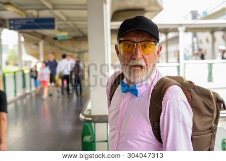 Handsome Senior Tourist Man Exploring The City Of Bangkok, Thail