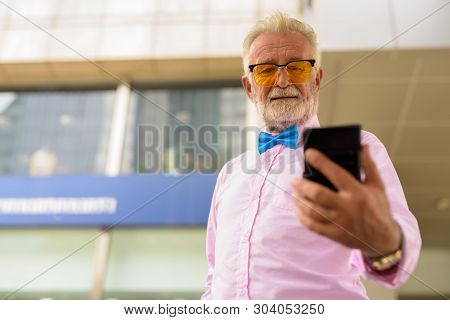 Handsome Senior Tourist Man Exploring The City Of Bangkok, Thail