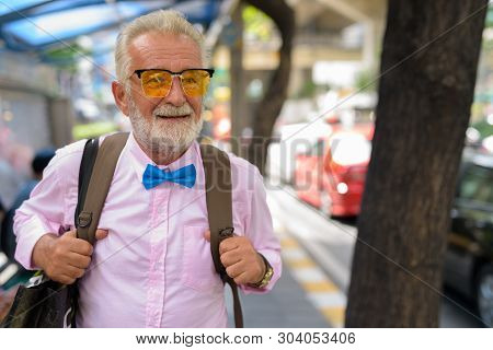 Handsome Senior Tourist Man Exploring The City Of Bangkok, Thail