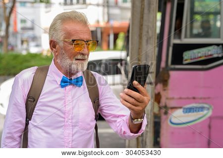 Handsome Senior Tourist Man Exploring The City Of Bangkok, Thail