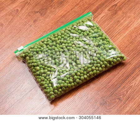 Green Peas Prepare For Freezing. Green Peas In A Transparent Vacuum Package