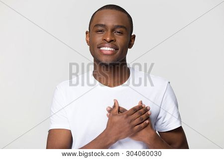 Headshot Portrait African Male Holding Hand On Heart Feels Gratitude