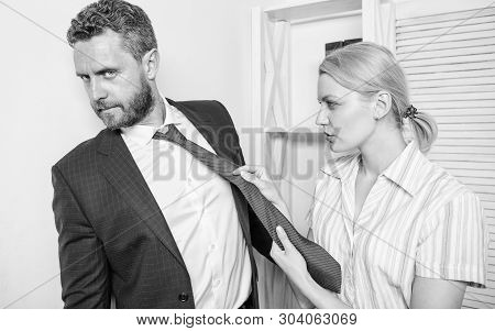 Office And Sexual Behavior. Woman Hold Mans Necktie. Girl Seduce Colleague. Sexual Harassment At Wor