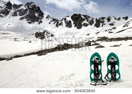 Snowshoes In Snowy Mountains And Cloudy Sky. Turkey, Kachkar Mountains, Highest Part Of Pontic Mount