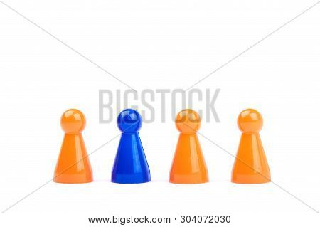 A Series Of Orange Game Pieces And One Different And Exceptional Blue Figure As Leader Or Boss - Iso