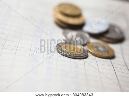Hand-written Calculations And Coins. Bookkeeping (accounting). Economy. Financial Themes. Money Savi