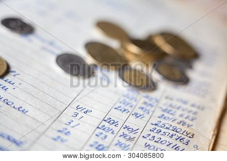 Hand-written Calculations And Coins. Bookkeeping (accounting). Economy. Financial Themes. Money Savi