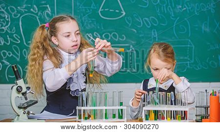 If At First You Dont Succeed Try Another Experiment. Small School Children Holding Test Tubes For La