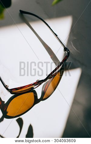 Sunglasses Being Picked Up By A Shadow In Directional Light.