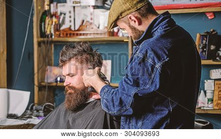 Hipster Lifestyle Concept. Hipster Client Getting Haircut. Barber With Hair Clipper Works On Hairsty