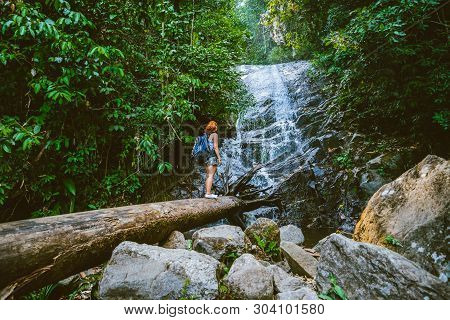 Women Travel. Woman Asia Travelers Travel Nature Forests, Mountains, Waterfalls. Travel Siliphum Wat