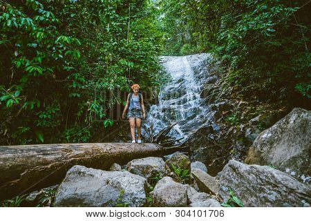Women Travel. Woman Asia Travelers Travel Nature Forests, Mountains, Waterfalls. Travel Siliphum Wat