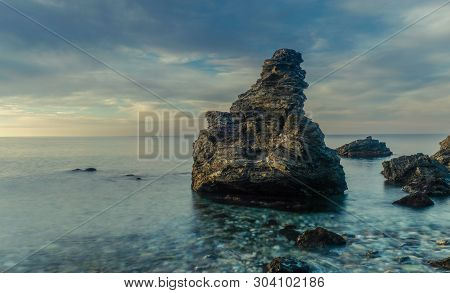 Nerja, Malaga, Andalusi, Spain - February 7, 2019: Molino Beach, Small Stone Beach With Large Rock O