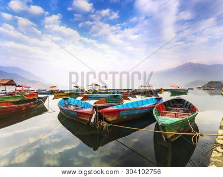 The Boats With Different Colors,the Blue Sky Reflection In The Water.view From Phewa Lake Pokhara Ne