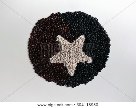 Three Kinds Of Beans Are Spread Out On The Surface In The Form Of A Flat Circle With A Star In The C