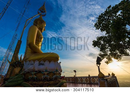 Buddha Statue On Mountain Sunrise Light In Morning