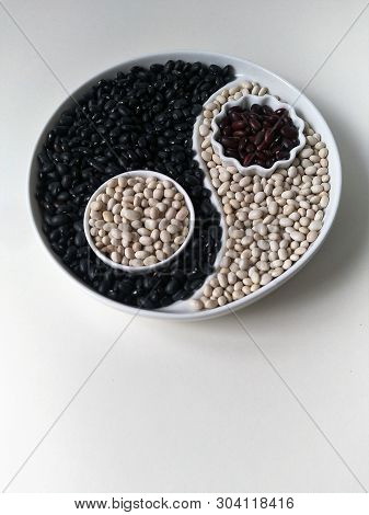 Three Colors Of Beans On A Yin Yang Plate