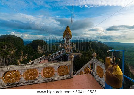Buddha Statue On Mountain Sunrise Light In Morning