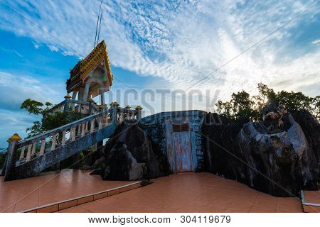 Buddha Statue On Mountain Sunrise Light In Morning