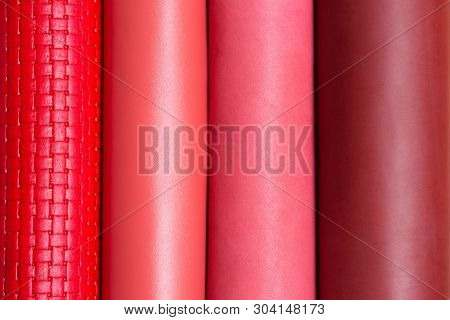 Red, Pink, Brown Vertical Leather Rolls For Background.