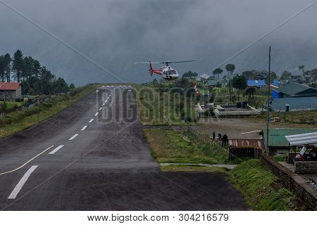The Helicopter  On The Runway Of The Tenzing-hillary Airport Lukla - Nepal, Himalayas