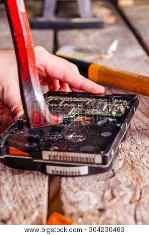 A Man Breaks A Computer Using Locksmith Tools.