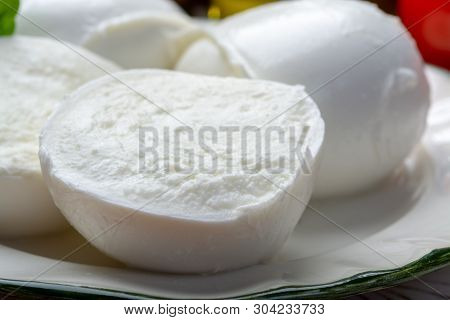 Balls And Pieces Of Buffalo Mozzarella, Soft Italian Scheese Made From The Milk Of Italian Mediterra