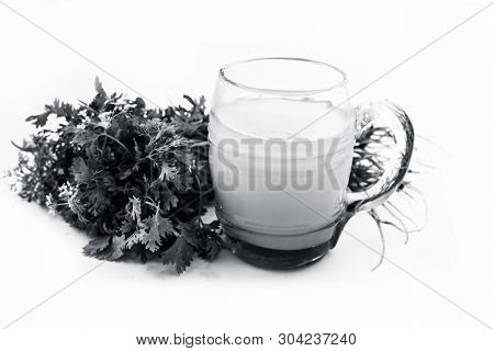 Fresh Parsley Juice  Or Coriander Juice In A Transparent Glass Isolated On White With Fresh Parsley