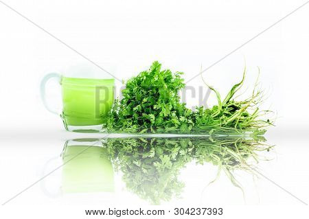 Fresh Parsley Juice  Or Coriander Juice In A Transparent Glass Isolated On White With Fresh Parsley 