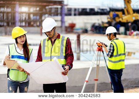 surveyor engineer with theodolite at construction site during surveying work.engineer and architect 