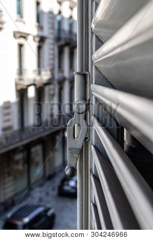 Window Latch Closeup With The Blurred Street View - Image