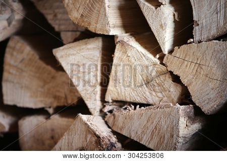 Split Fire Wood. Dried, Split and Stacked Firewood. Old Dried Dead Trees cut up and split in to pieces for future fires and wood burning stoves and fireplaces. 
