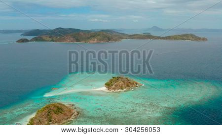 Aerial Seascape Tropical Island And Sand Beach, Turquoise Water And Coral Reef. Malacory Island, Phi