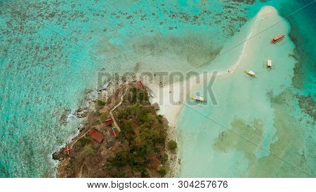 Aerial Seascape Tropical Island And Sand Beach, Turquoise Water And Coral Reef. Malacory Island, Phi