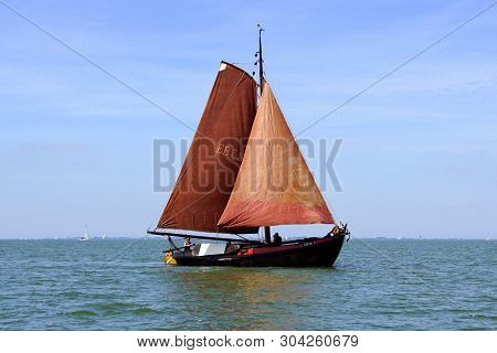 Almere, The Netherlands - June 1, 2019: Historic Dutch Botter Eb58 Sailing By On A Sunny Day.