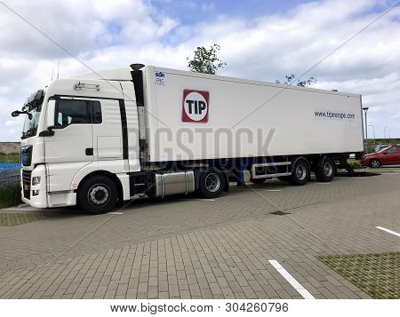 Almere, The Netherlands - May 31, 2019:  Tip Transport Truck And Trailer Parked By The Side Of The R