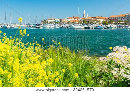 Izola, Slovenia - May 1, 2019: Scenic Harbour With Boats And Brightly Coloured Houses On The Flowers